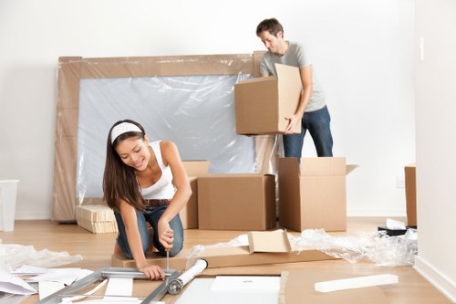 Moving team loading household items for a Downham home move
