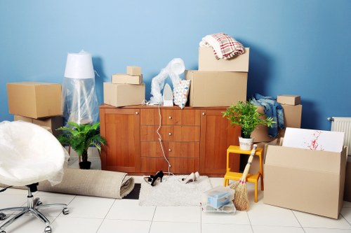 Furniture and boxes being moved from a flat in Downham