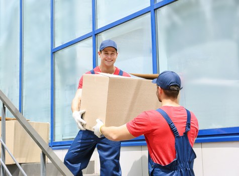 Man and van loading furniture for a Downham move