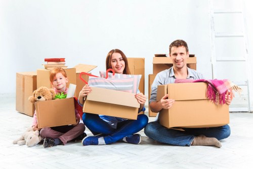 Packed moving boxes and household items inside a removal van