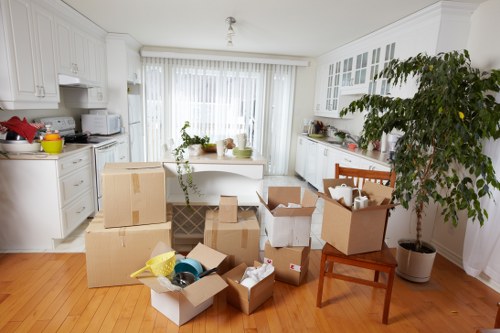 Professional movers handling furniture during a local home relocation