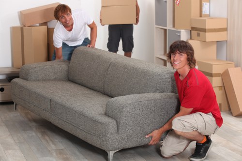Packed office equipment and boxes ready for a business move in Downham
