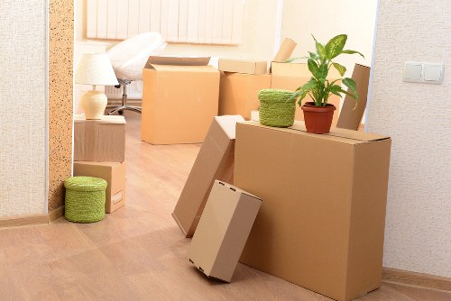Local movers handling furniture in a Downham commercial property